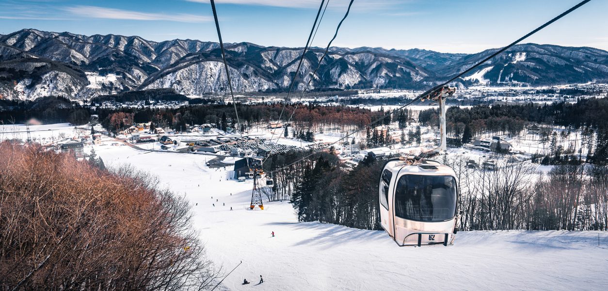 Skiing and snowboarding in Hakuba, Japan, with stunning mountain views and fresh powder snow
