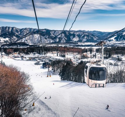 Skiing and snowboarding in Hakuba, Japan, with stunning mountain views and fresh powder snow